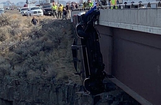 Couple rescued from truck hanging hundreds of feet over bridge