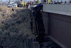 Couple rescued from truck hanging hundreds of feet over bridge