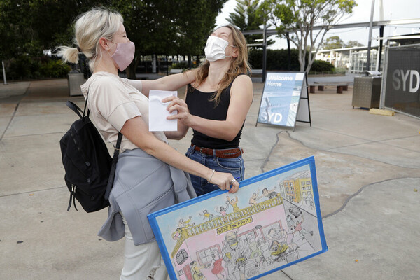 Scenes of joy as Australia's international travel restarts after nearly 20 months