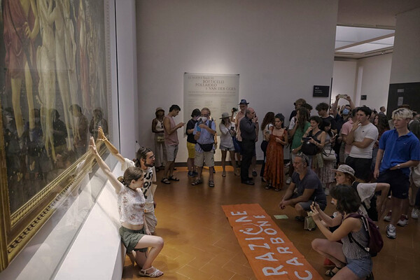 Climate activists in Italy glue themselves to Botticelli painting