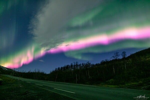 Solar Storm Causes Neon-Pink Northern Lights To Fill the Sky