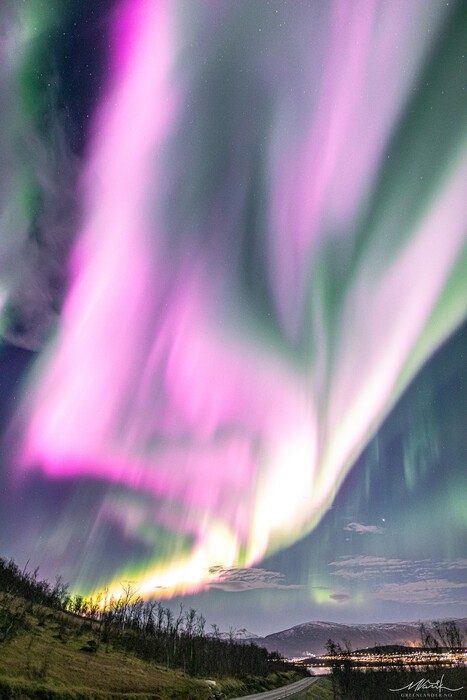 Solar Storm Causes Neon-Pink Northern Lights To Fill the Sky